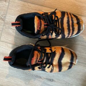 Women’s tiger striped puma sneakers.